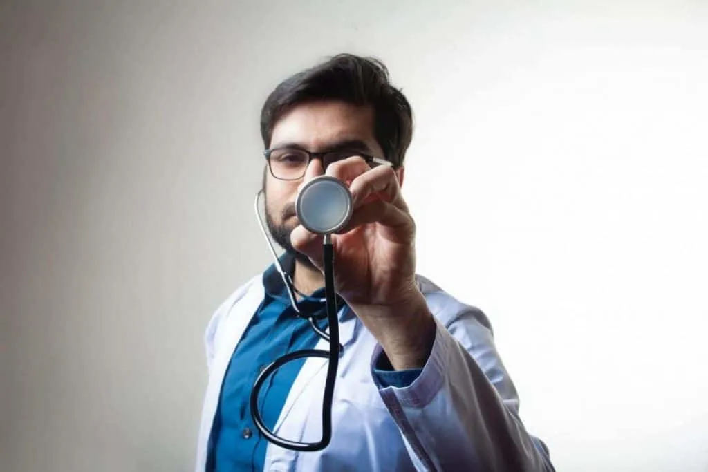 A doctor holding a stethoscope.