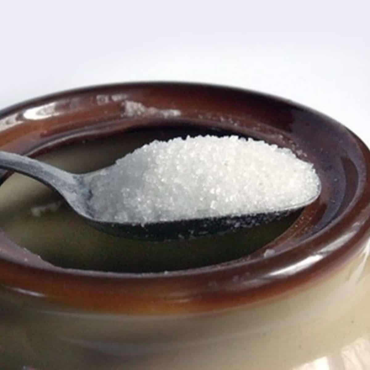 granulated sugar on a spoon