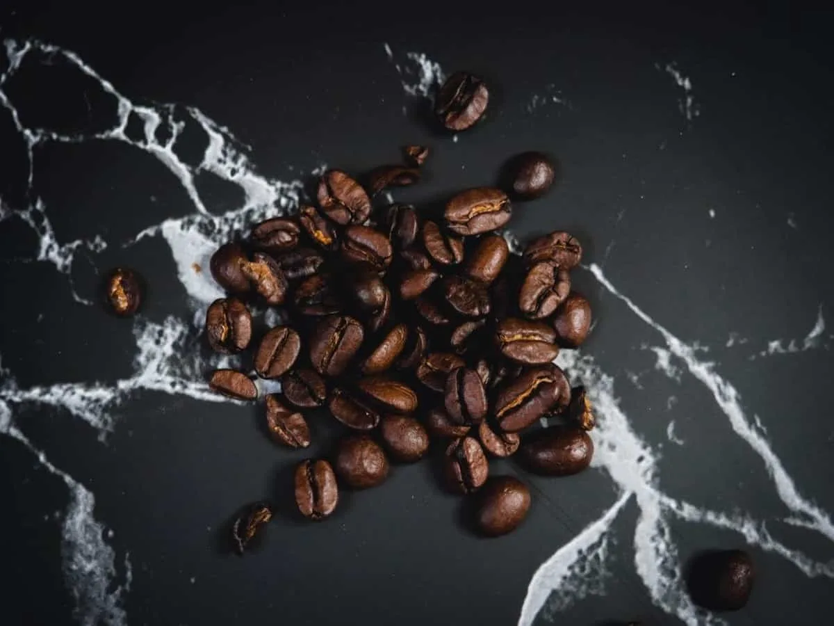 A picture of coffee beans in a black background.
