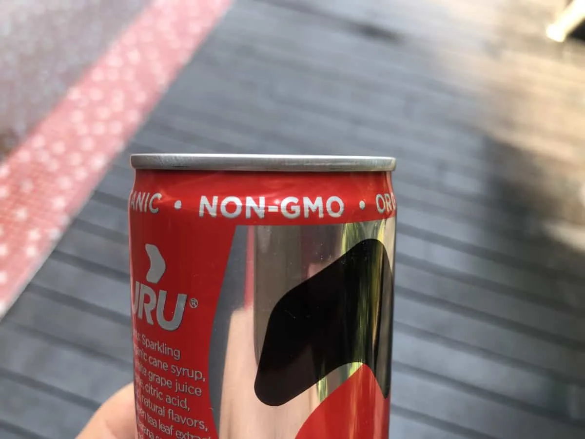 A photo of Guru energy drink stating it is Non-GMO.