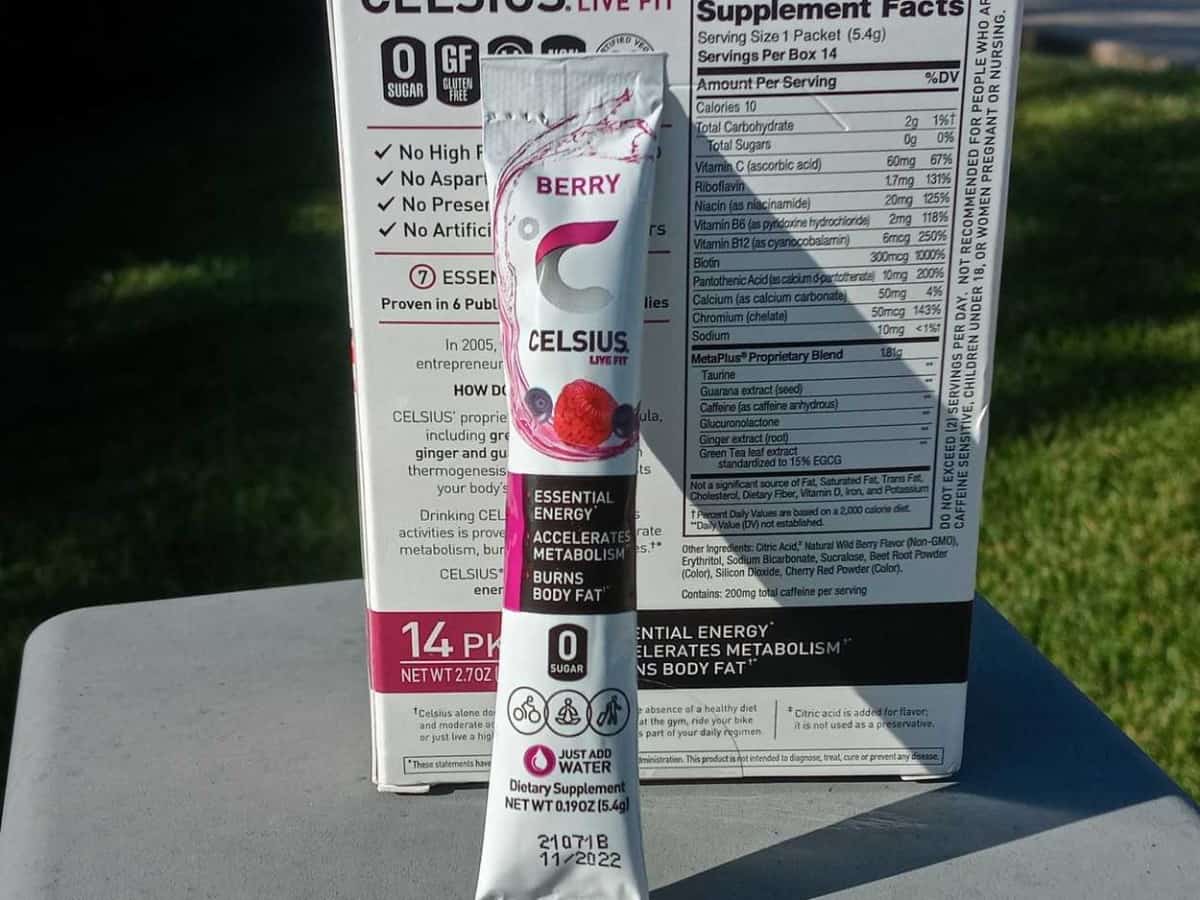A stick packet of Celsius On The Go leaning against a box of Celsius On The Go 