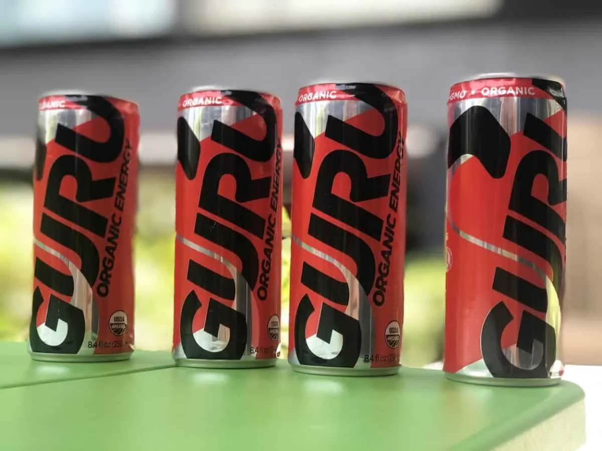 Four cans of Guru Organic Energy drink