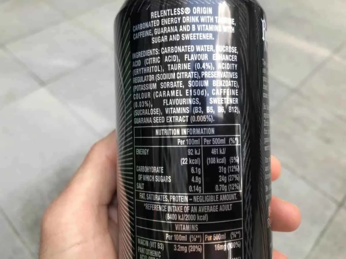 A photo of the nutrition facts of Relentless energy drink, held in a hand