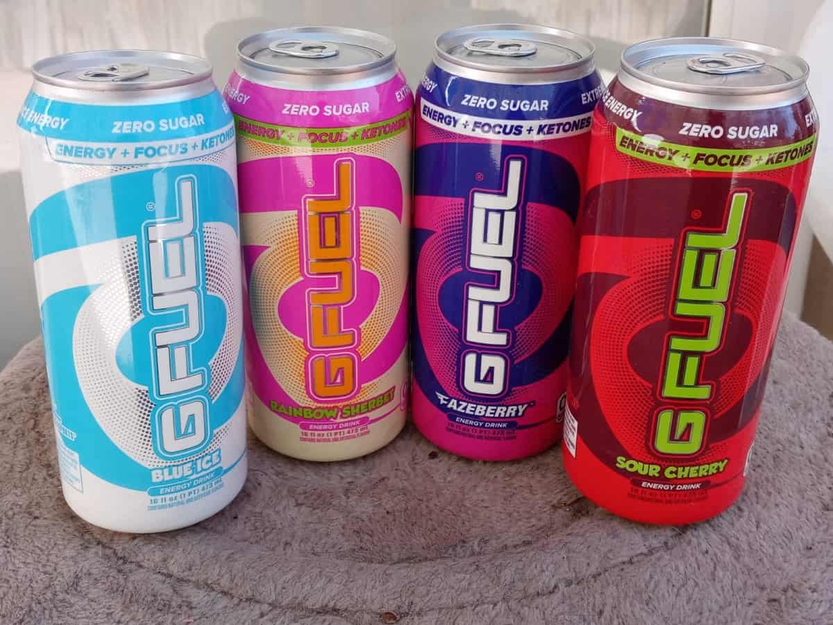 A photo of different flavors of G Fuel cans in a table