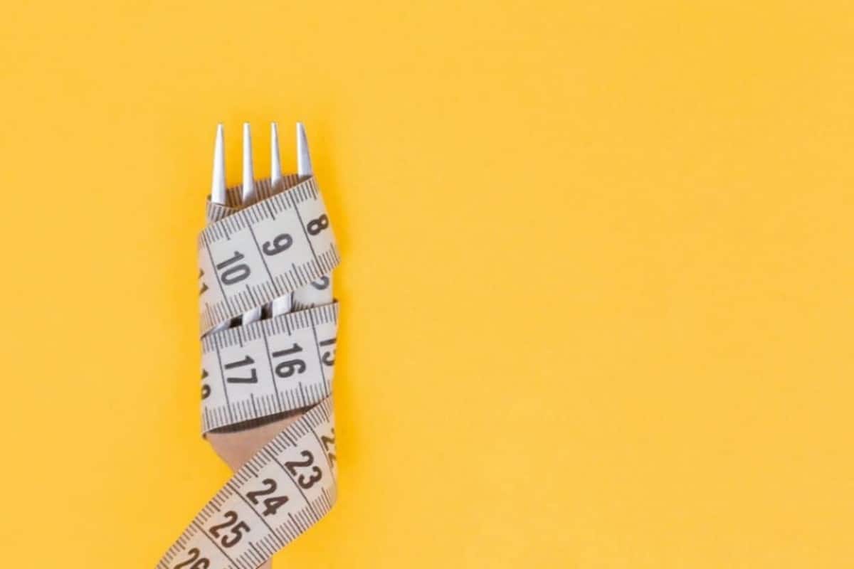 fork wrapped in measuring tape