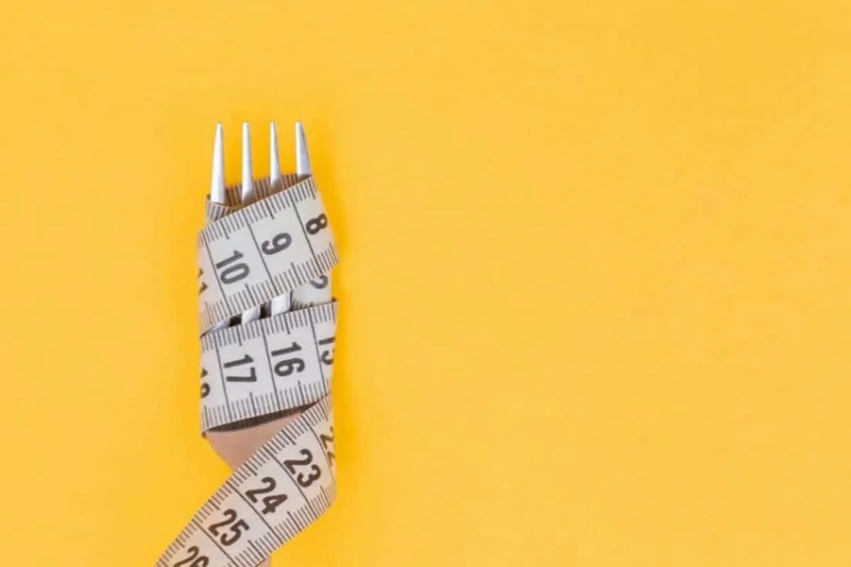 fork wrapped in measuring tape