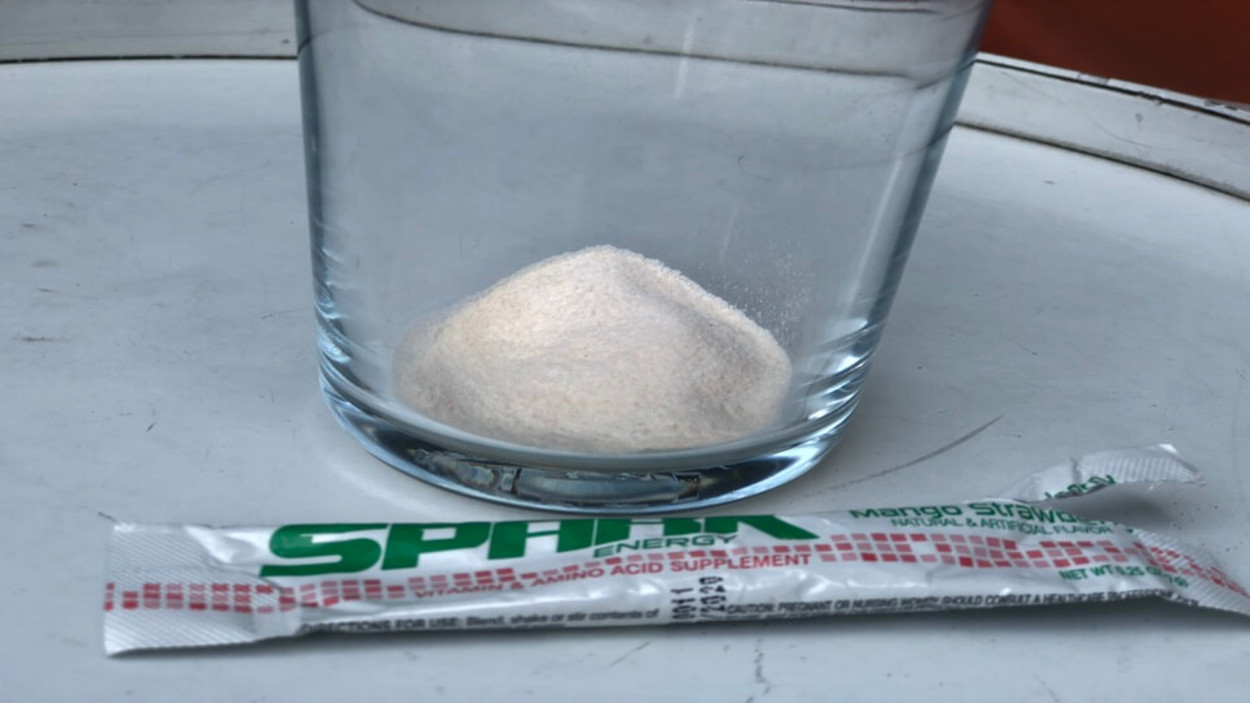 Powdered contents of Advocare Spark energy drink in a glass