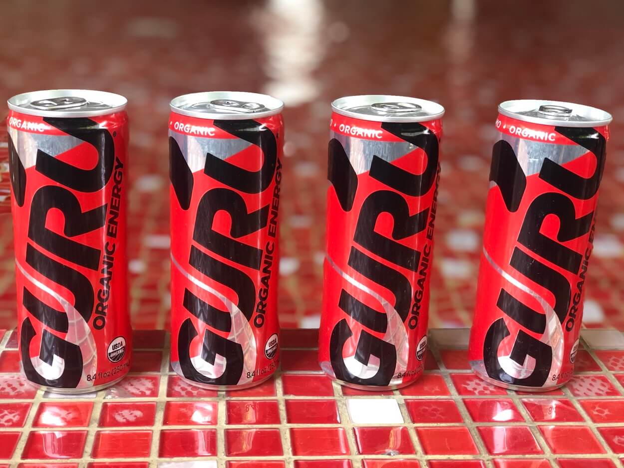 Four cans of GURU Energy