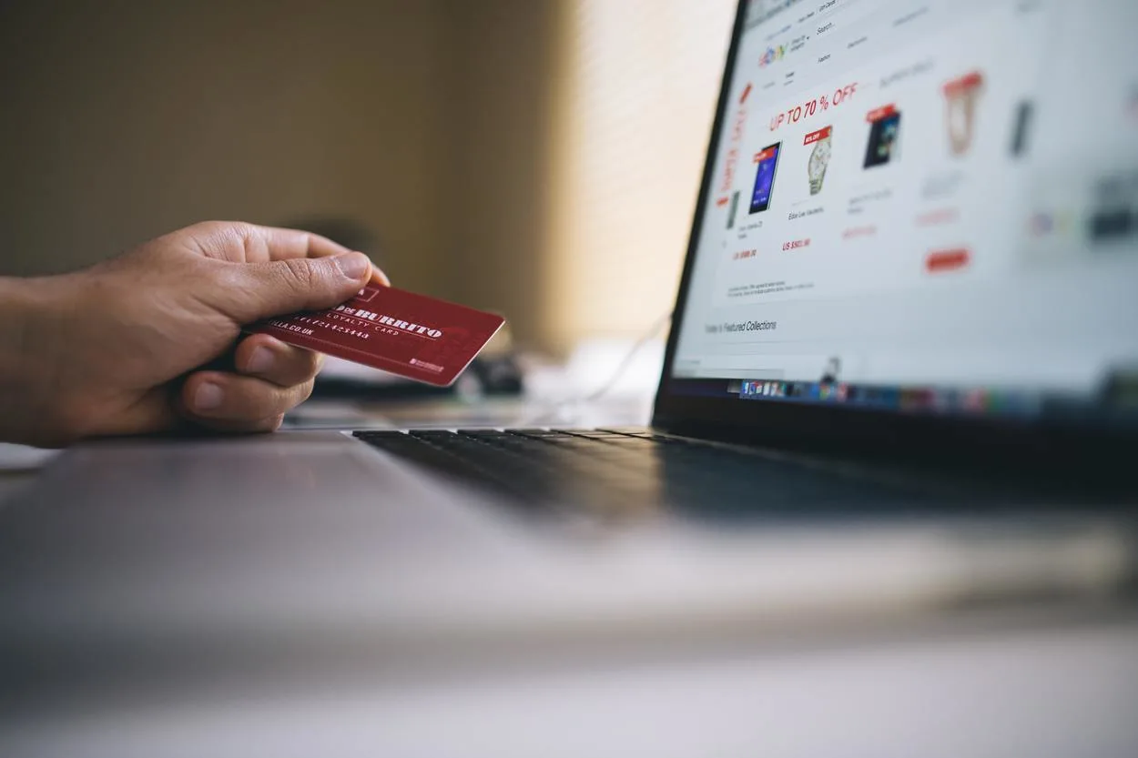 Image of person doing online shopping through credit card