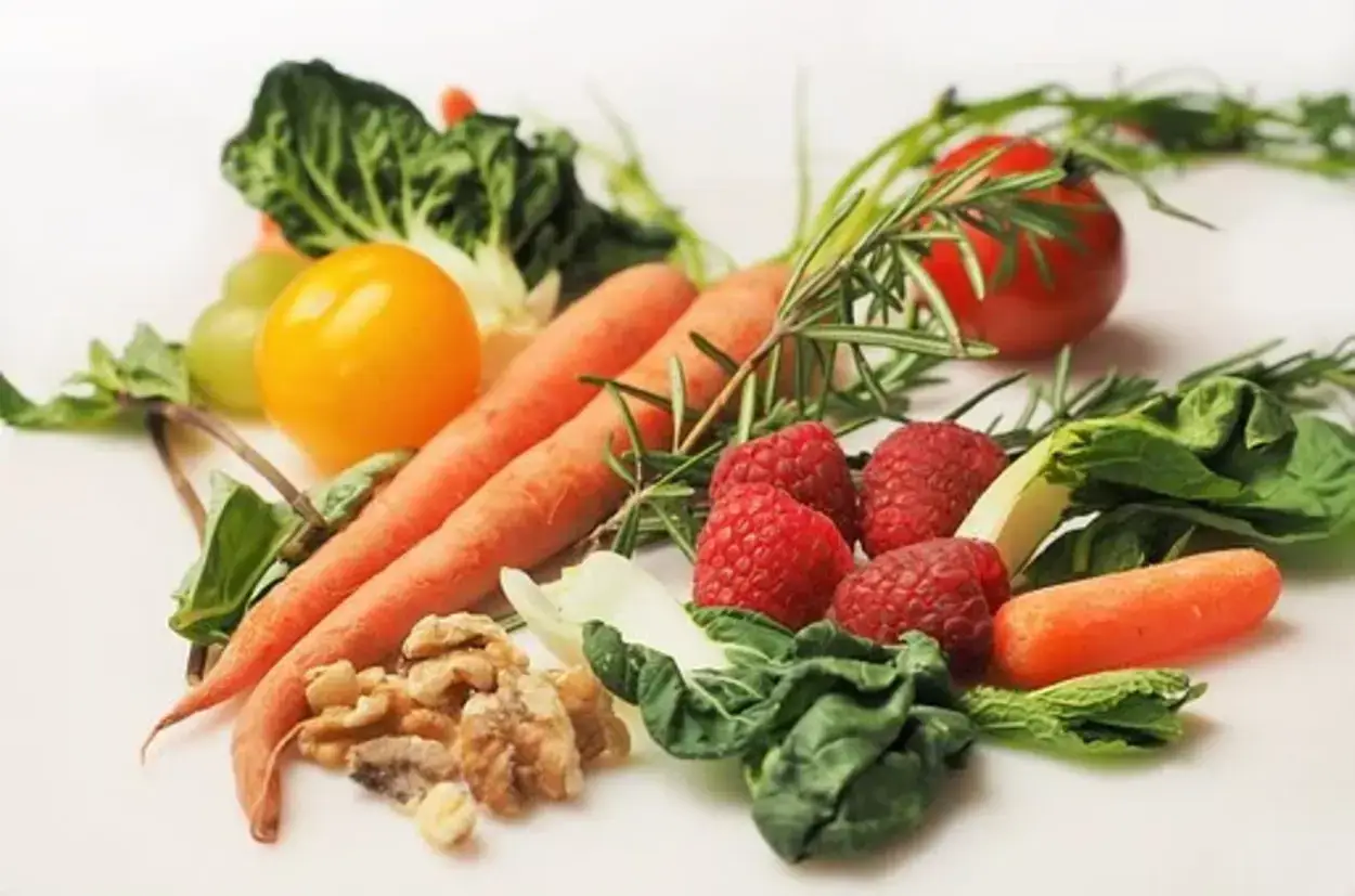 Image shows vegetables and fruits that contain vitamins