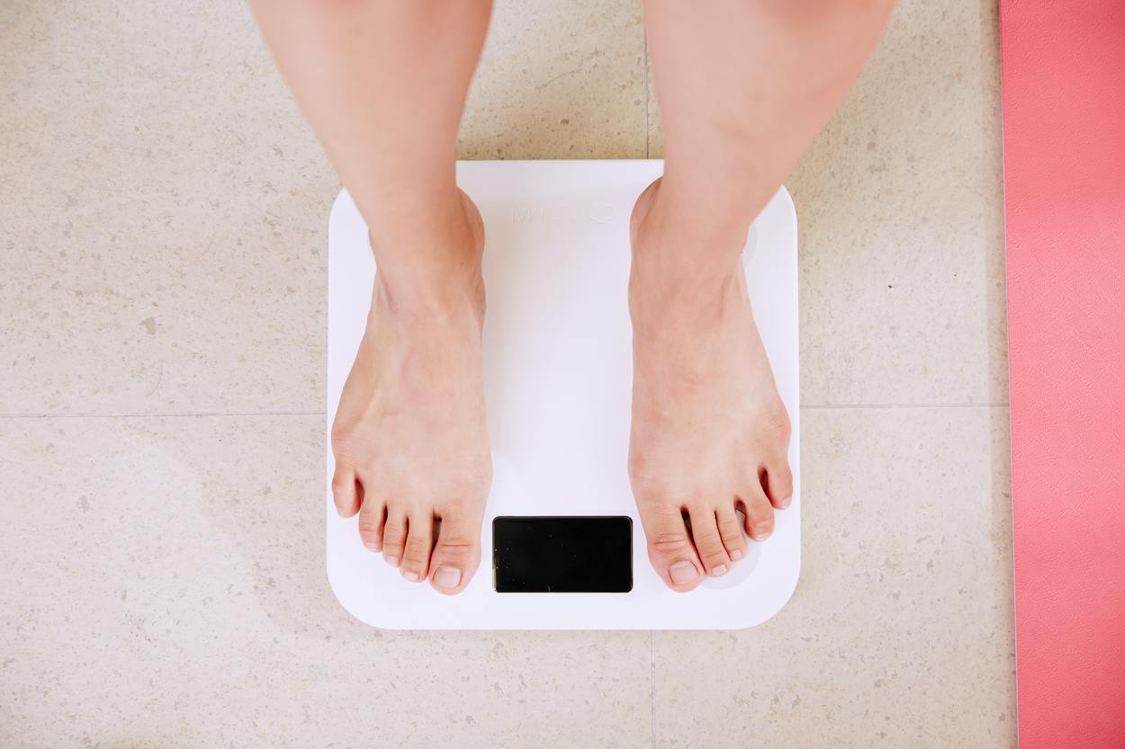 Person in a weighing scale.