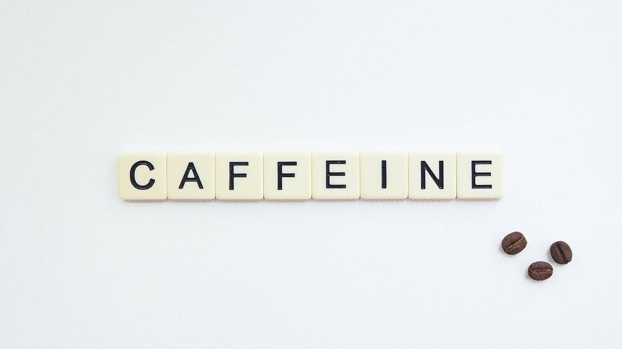 "Caffeine" written with white blocks
