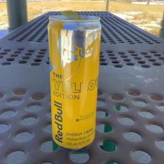 A can of Redbull ywllow