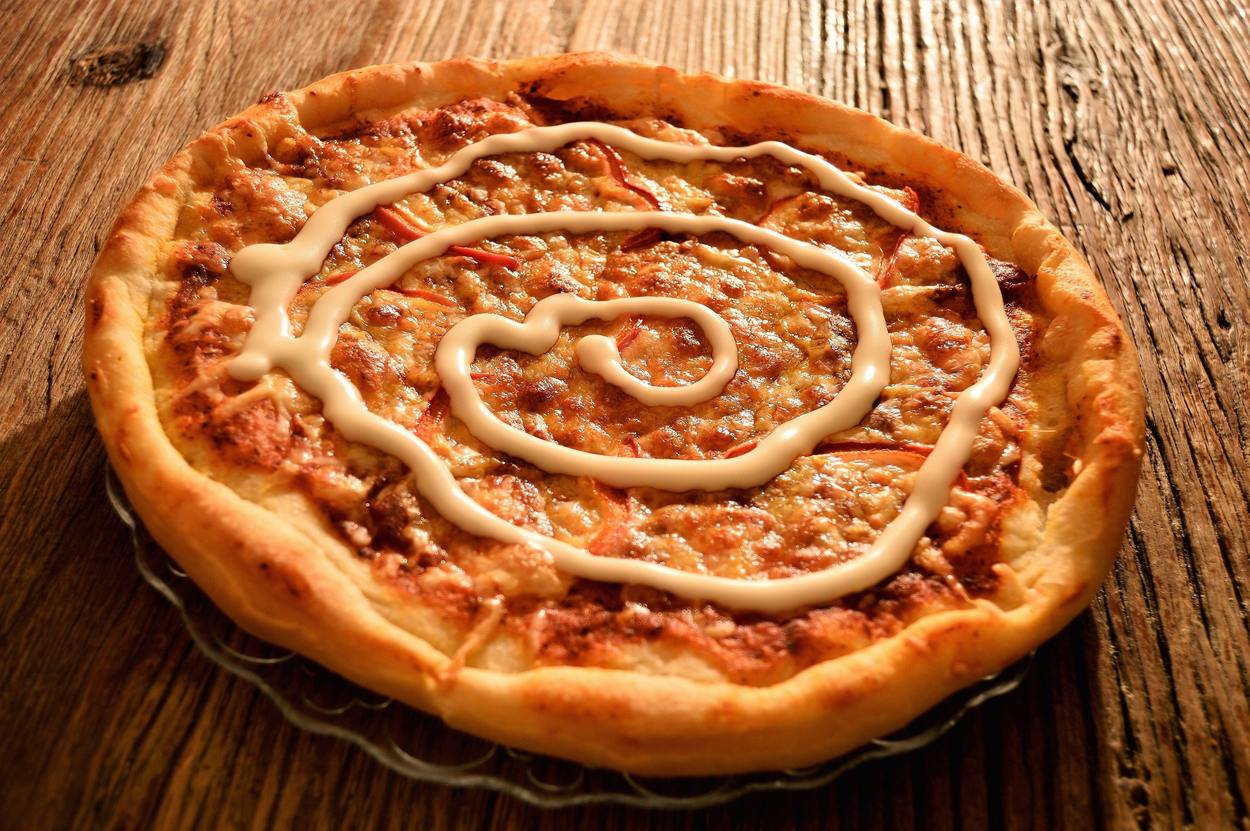 Image of pizza on a table.
