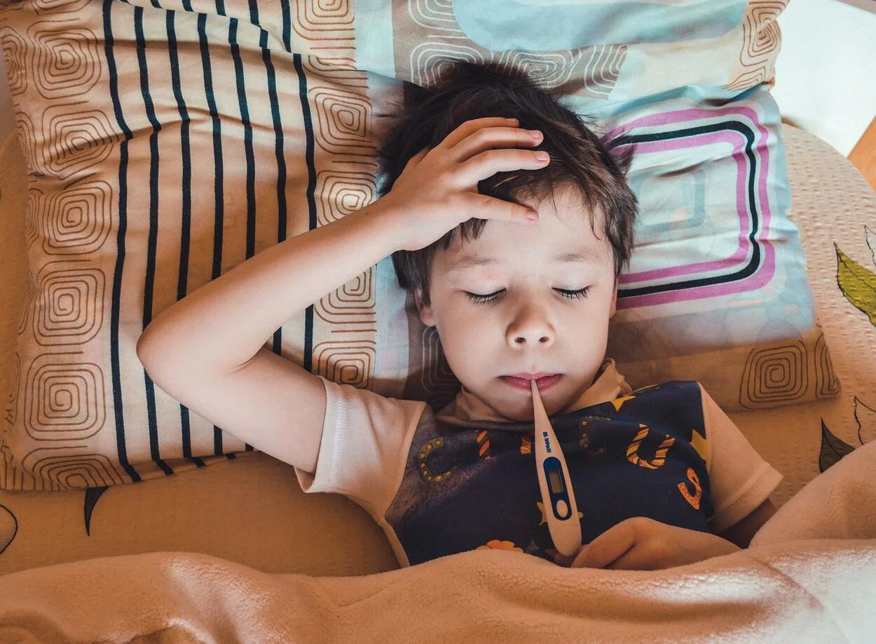Image of a kid with flu.