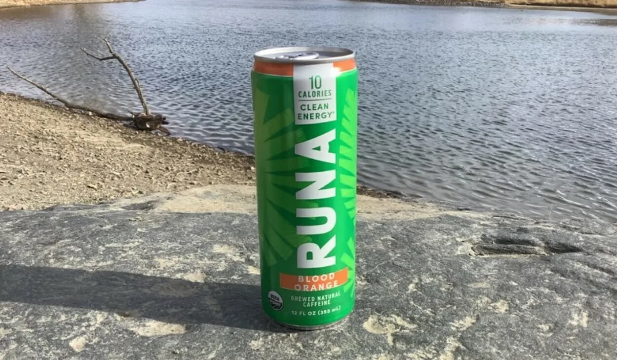 a can of Runa on a rock